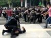 Polisi diduga membanting satu peserta aksi di Tigaraksa. Foto : Ist